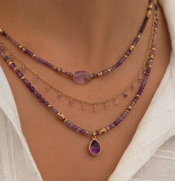 Layered amethyst and gold-accent sterling silver necklaces from the AG Elements Everyday Stacking collection, worn close-up