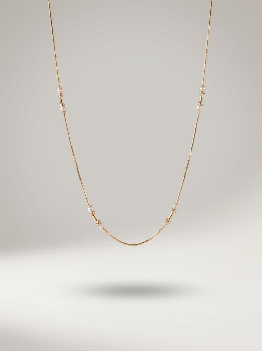 Elegant Gold Pearl Station Necklace